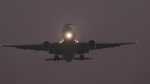 Passenger plane landing at night Stock Footage 310877868