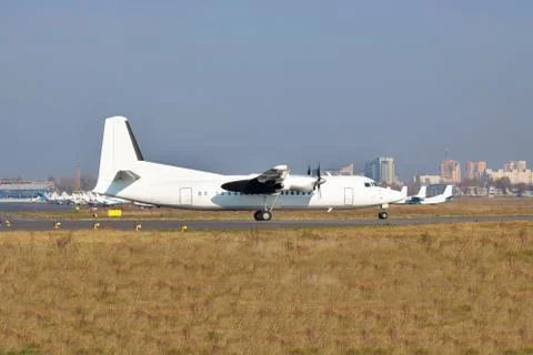 Passenger plane on runway Stock Photos