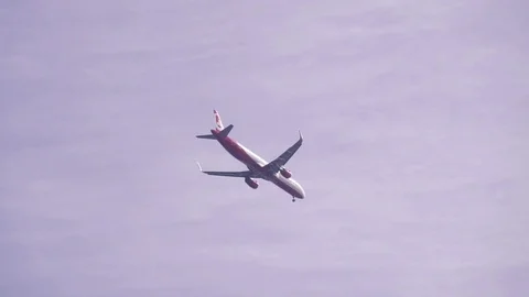 Passenger plane in the sky Stock Footage 71454722