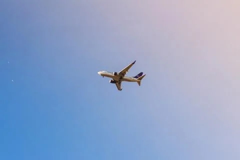 Passenger plane in the sky Stock Photos