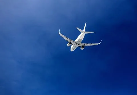 Passenger plane in the sky Stock Photos