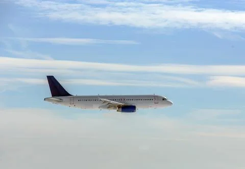 Passenger plane in the sky Stock Photos