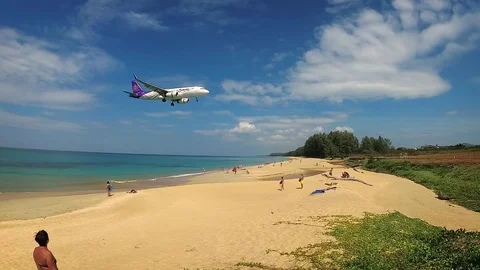 Passenger plane from Thai Airways, landing over beach in Phuket, Thailand Stock Footage 89727012