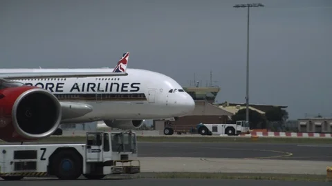 Passenger Planes Being Pulled Across Runway Stock Footage 94134537