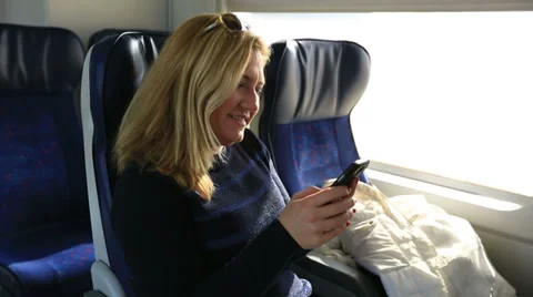 Passenger playing smartphone Видео 34812551