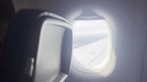 Passenger point of view footage looking out of an airplane window Stock Footage 340106425