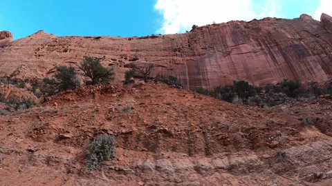 Passenger point of view perspective driving through red rock canyon Escalante UT Vidéo 248558650
