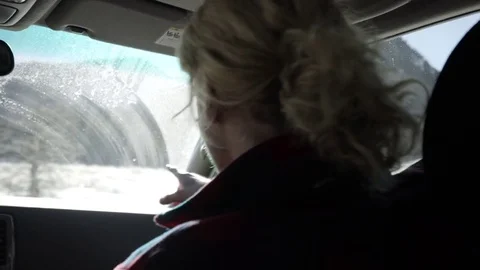 Passenger Points Out A Spot To Park In Utah Mountains, Driver Pulls Over Stock Footage 72331264