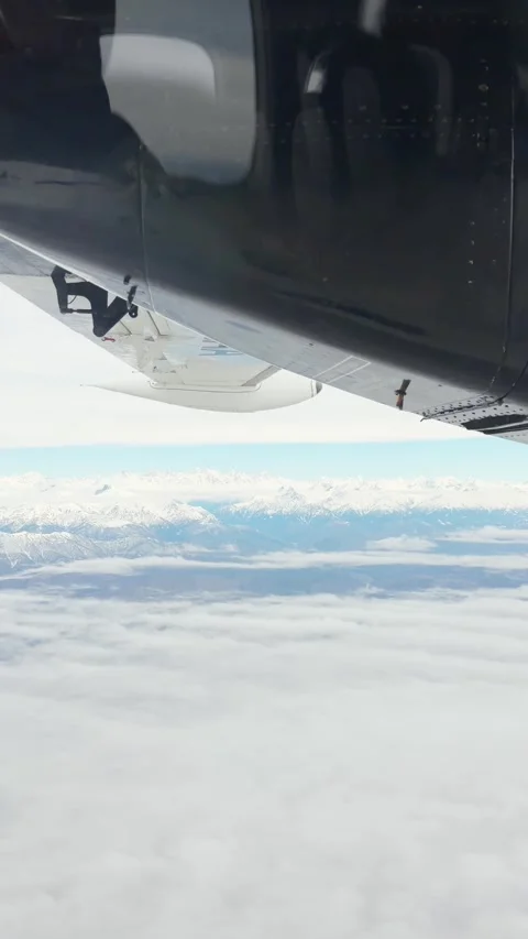 Passenger POV aircraft window framing black turboprop engine nacelle spinni.. Stock Footage 342929926