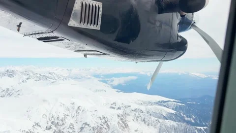 Passenger POV aircraft window framing black turboprop engine nacelle spinni.. Stock Footage 342930355