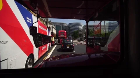 Passenger pov double deck routemaster bus downtown London, taxis on street Stock Footage 116680970