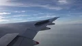 Passenger POV out of wing Boeing 777-300 window seat morning clouds 4k or 4k+ Resolution