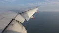 Passenger POV out of wing Boeing 777-300 window seat descent landing flaps 4k or 4k+ Resolution