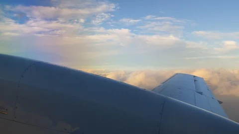 Passenger POV small prop plane flying over clouds Stock Footage 107938444