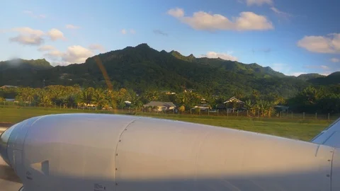 Passenger POV small prop plane take off from tropical island Stock Footage 107938548