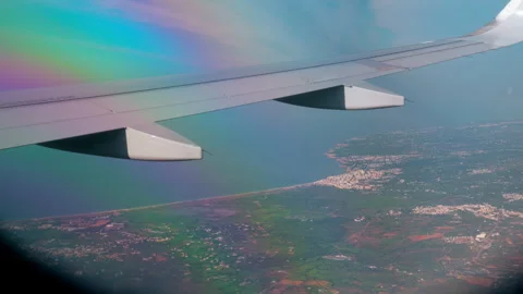 Passenger POV view from an airplane window flying above fluffy clouds Stock-Footage 336717962