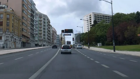 Passenger POV zig-zagging busy urban street in Lisbon near Marques de Pombal and Stock Footage 116440463