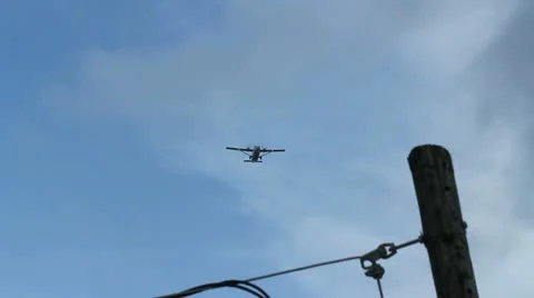 Passenger propeller plane flying overhead 2 Stock Footage 11699559