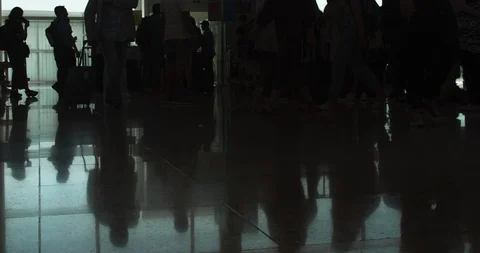 Passenger Queue at Gate before the Flight. People Silhouettes. Reflections on Stock Footage 112687080