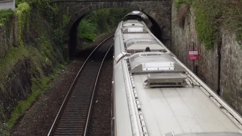 Passenger railway train coming out of tunnel Stock Footage 335301516