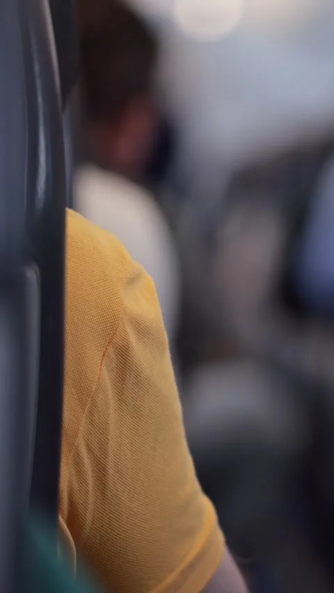 Passenger Resting In Train. Calm Passenger Seated Peacefully Inside Warmly Lit 스톡 동영상 333441482