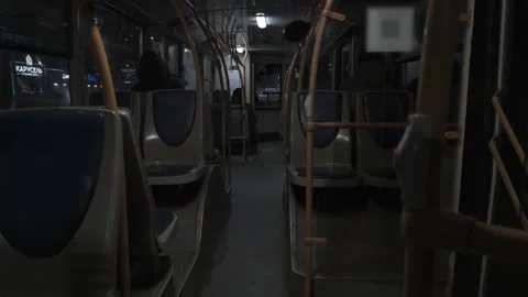 A passenger rides inside an empty public bus at night. Passenger transportation Video stock 304106780