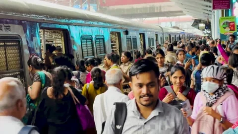 Passenger Rush to Board Local Train at Dadar station Mumbai city. 4K (Dangerous) Stock Footage 247169570