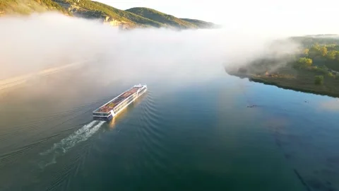 Passenger ship flowing on the Rhone River in the morning with a thick fog Stock Footage 219964185