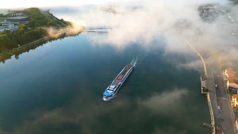 Passenger ship flowing on the Rhone River in the morning with a thick fog Stock Footage 219964209