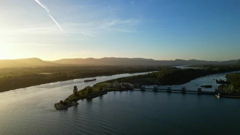 Passenger ship passing during sunrise in the Rhône riverbed in southern France Stock Footage 252762007