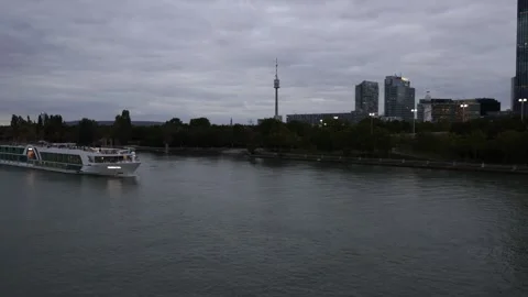 A passenger ship sails along the Danube in Vienna, Austria Stock Footage 319394183