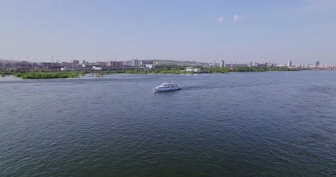 A passenger ship sails down a river Stock Footage 171138374