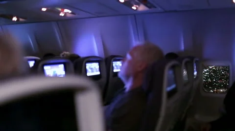 Passenger Sleeps Overnight Flight and Airplane Window Seat - View of Los Angeles Stock Footage 44113743