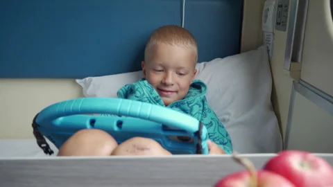 Passenger Smiles While Engaged with Tablet and Snacks in a Cozy Train Cabin Video stock 318477519