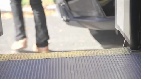 Passenger Stepping Off a City Bus at the Exit Stock Footage 332688889