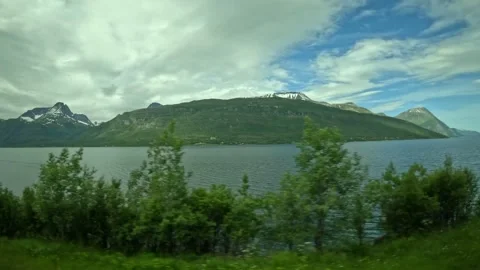 Passenger tracking shot of arctic mountain landscape and fjord water surface Vídeos de archivo 340960147