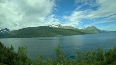 Passenger tracking shot of panoramic nordic fjord scenery and arctic mountains Vidéo 340960149