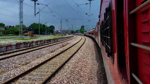 Passenger Train Approaching Railway Station Stockbeeldmateriaal 341731950