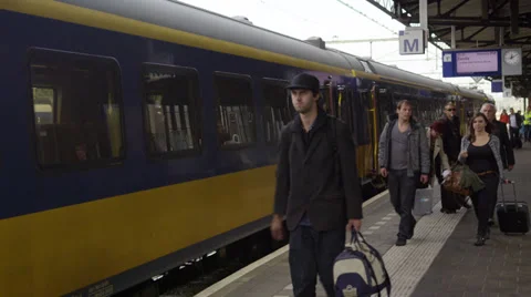Passenger train arriving and passengers disembarking Stock Footage 39651272
