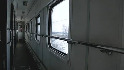 Passenger train car from the inside. Winter landscapes rush past the windows. Stock Footage 295809808
