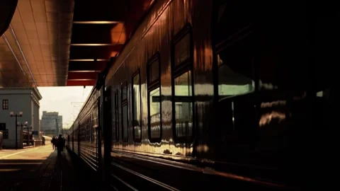 Passenger train carriages at the railway station against the backdrop of the Stock Footage 303621831