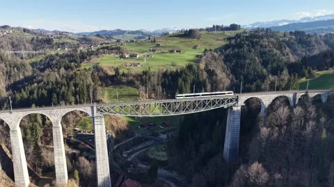 Passenger Train Crossing High Mountain Viaduct From Right To Left 스톡 동영상 330082841