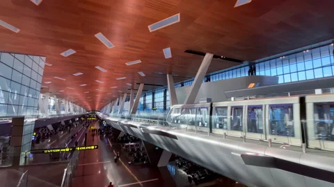 Passenger Train departing from platform in Hamad International Airport. Stock-Footage 169096480