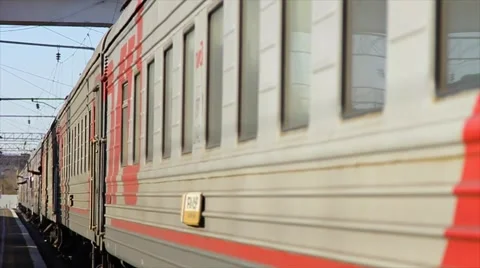 The passenger train departs from the platform. Closeup. Stock Footage 64636334