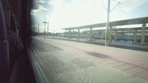 Passenger train drives off from the platform, view from the carriage window Stock Footage 161193643