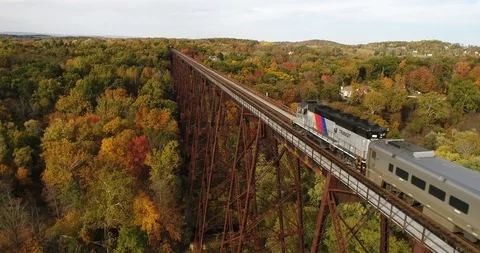 Passenger train going away in Slow Motion -  4k EPIC ! Stock Footage 111357189
