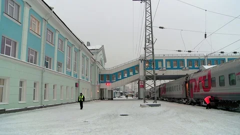 The passenger train has just arrived on the platform in winter Stock Footage 73723980