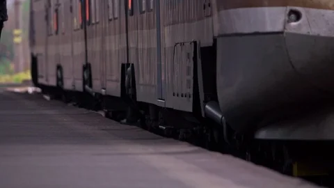 Passenger train leaving the station Stock Footage 98536046