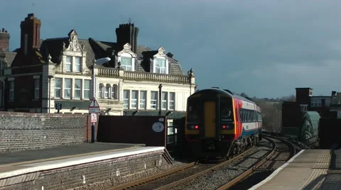 Passenger train leaving station victorian railway hotel background Stock Footage 47267356