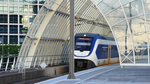 Passenger train leaving the train station. Stock Footage 66186448